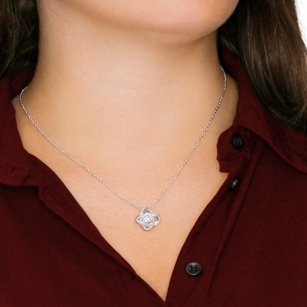 Love knot necklace worn — 14K white gold finish