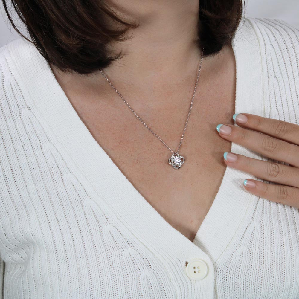 Love knot necklace worn — 14K white gold finish