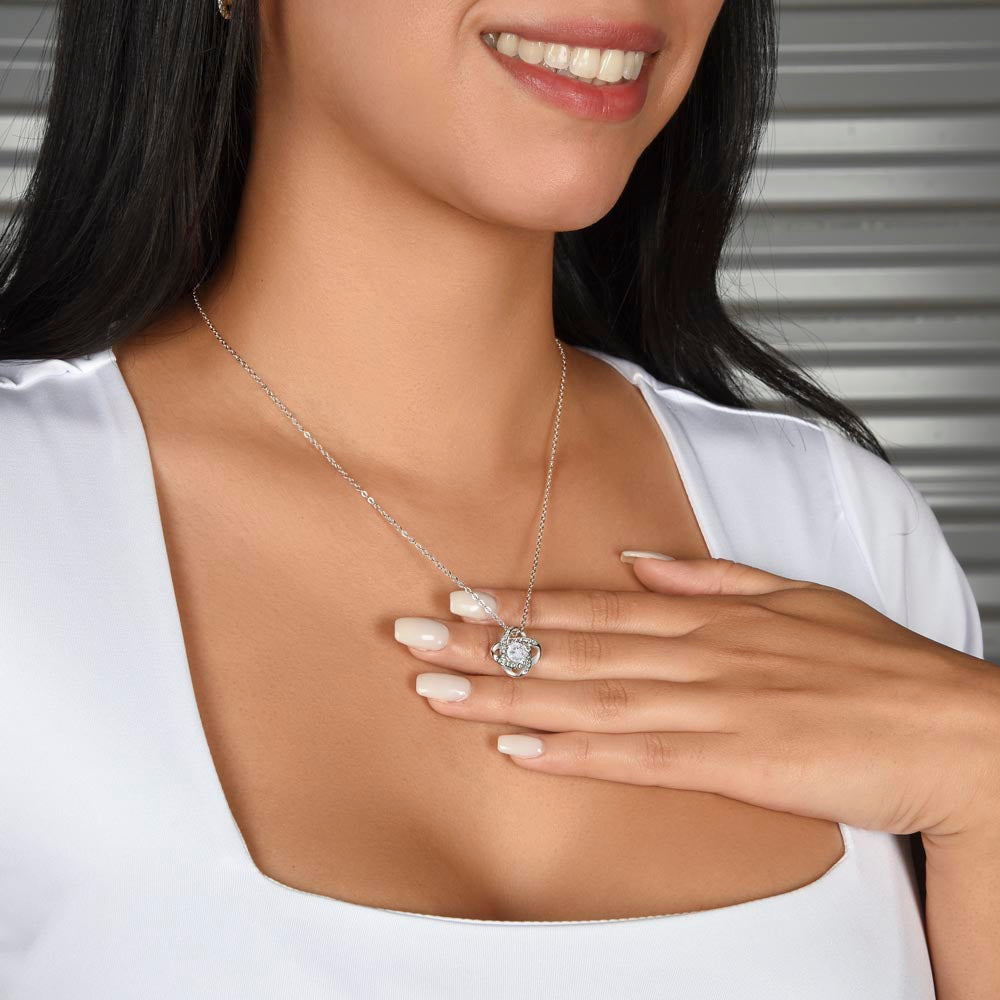 Love knot necklace worn — 14K white gold finish