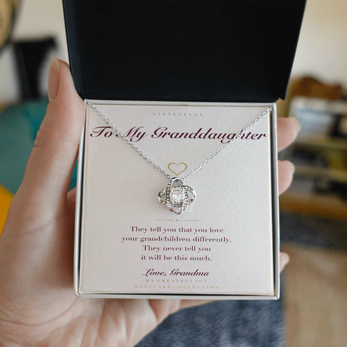 Personalized necklace with keepsake card, held in hand