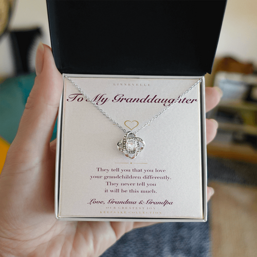 Personalized To My Granddaughter necklace with keepsake card, held in hand