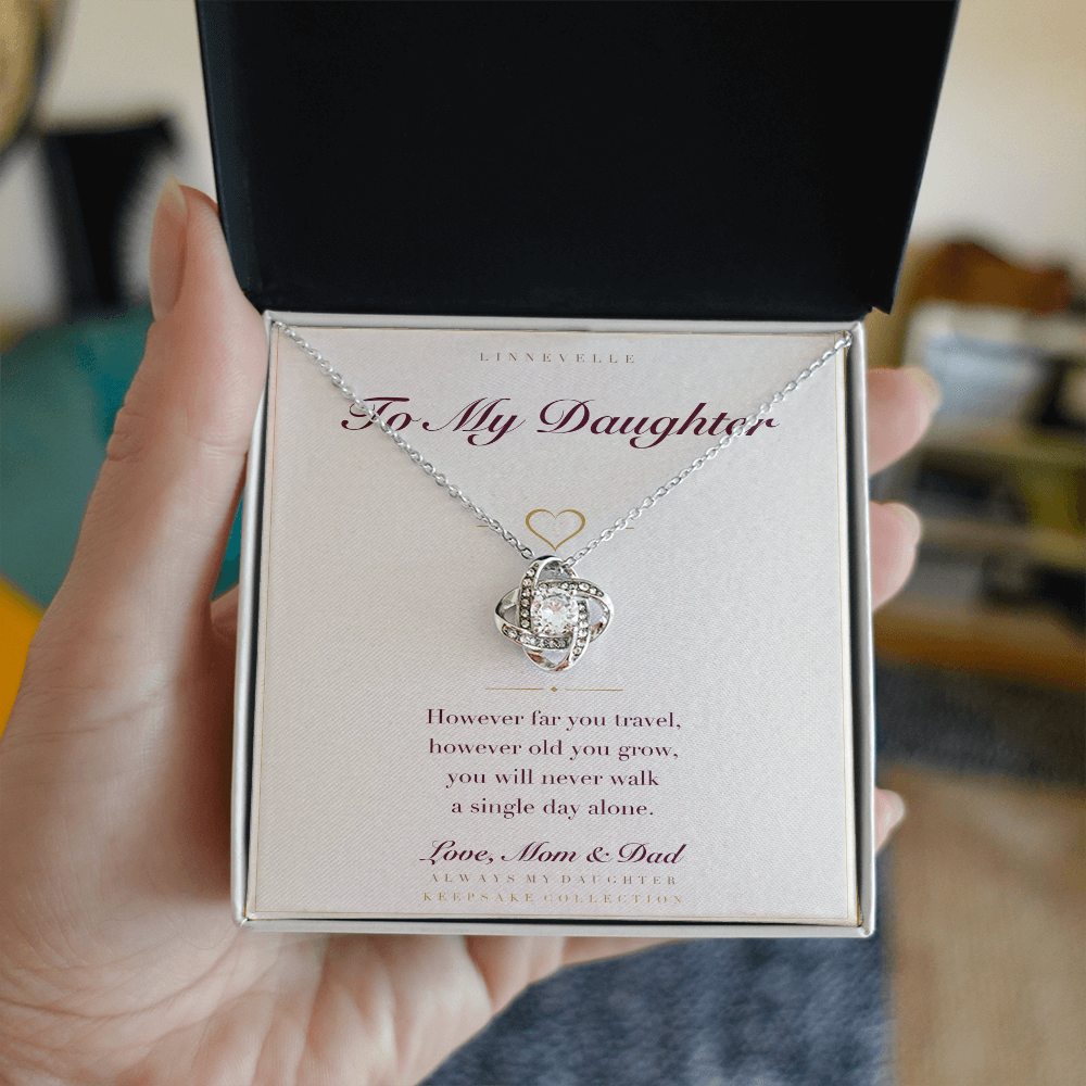 Personalized necklace with keepsake card, held in hand